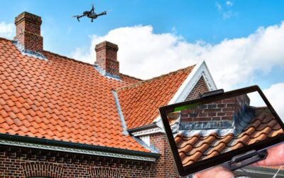 Drone in the air inspecting the roof over the house. Close-up of